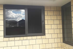 Stainless steel security screen over kitchen slider window